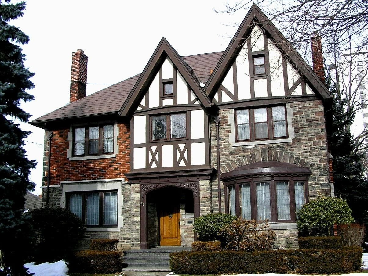 Английский фасад дома. Стиль Тюдор (Tudor Revival Cottage). Особняк Тюдоров в Англии. Тюдоровский стиль домов в Англии. Английский стиль фахверк Тюдор.