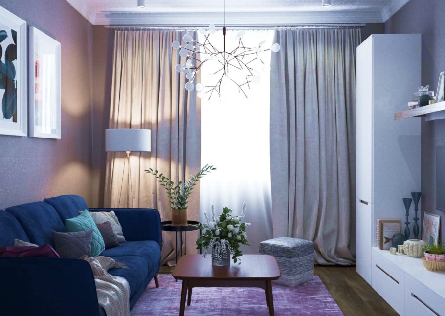 Синие шторы в интерьере маленькой гостиной