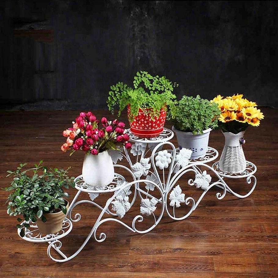 Кованые подставки для цветов напольные красивые