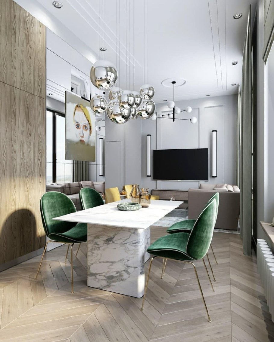 Изумрудные стулья в интерьере кухни гостиной