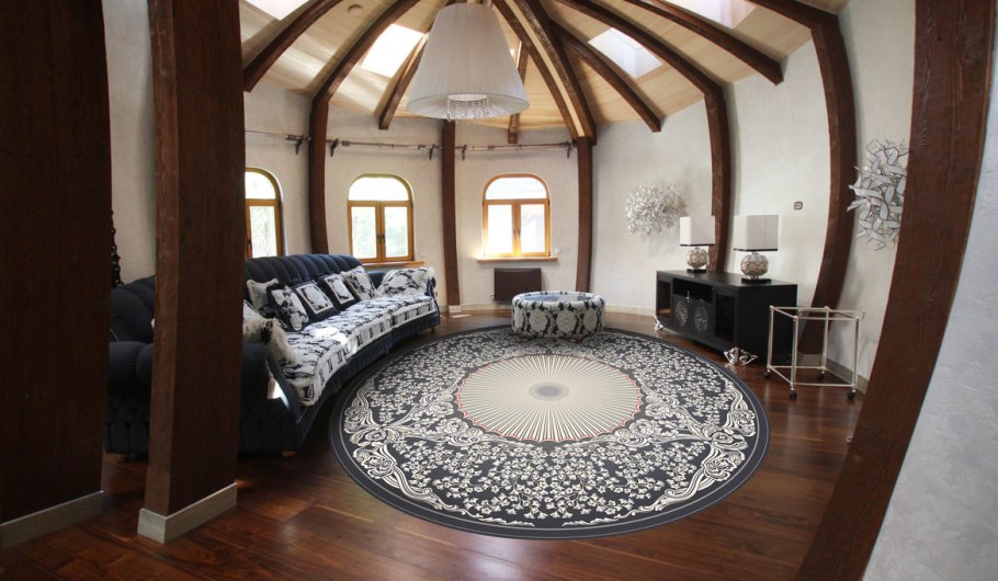 Круглый ковер в интерьере гостиной