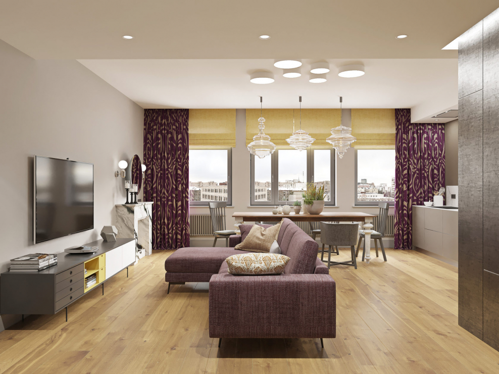 Трековый светильник в интерьере квартиры над диваном