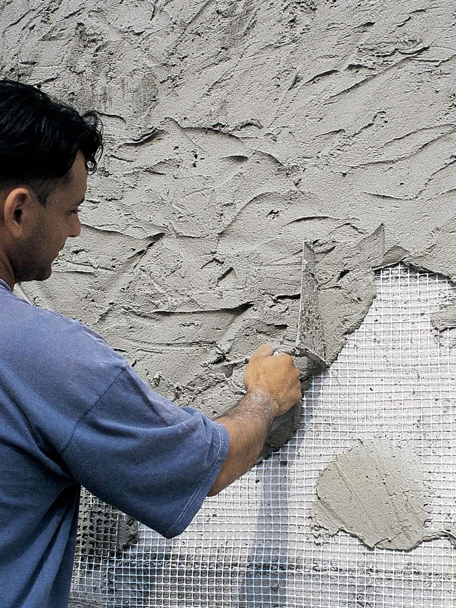 Нанесение фасадной штукатурки