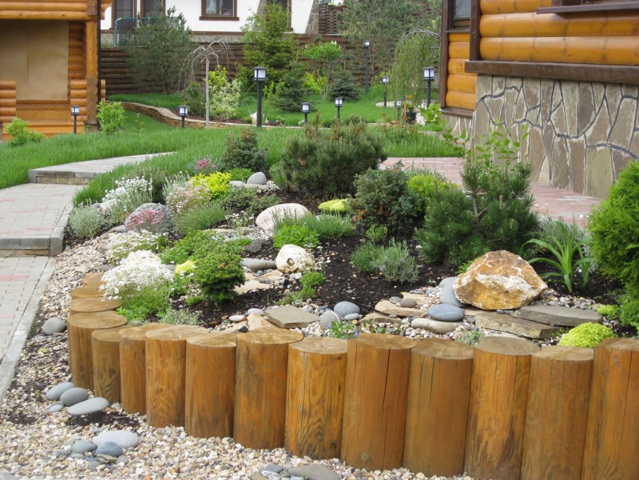 Террасирование участка бревнами