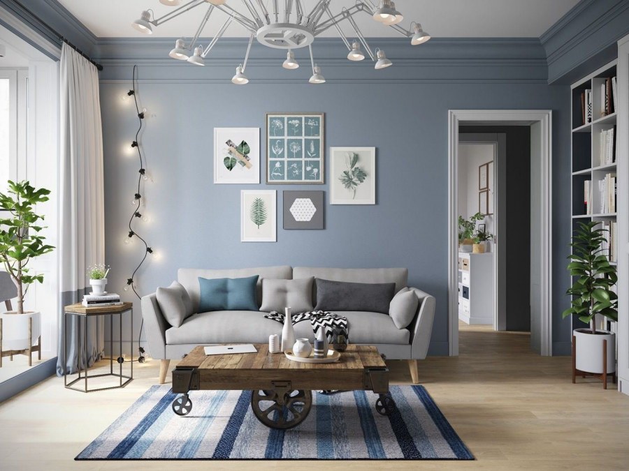 Гостиная в скандинавском стиле с серым диваном