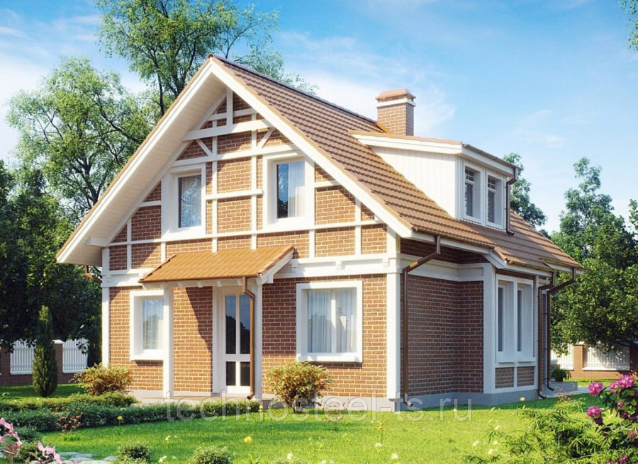 Красивый фасад дома с мансардой