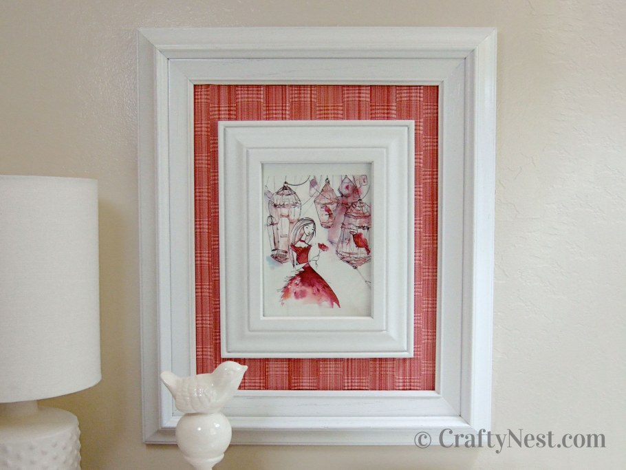 Вышивка в рамке на стене