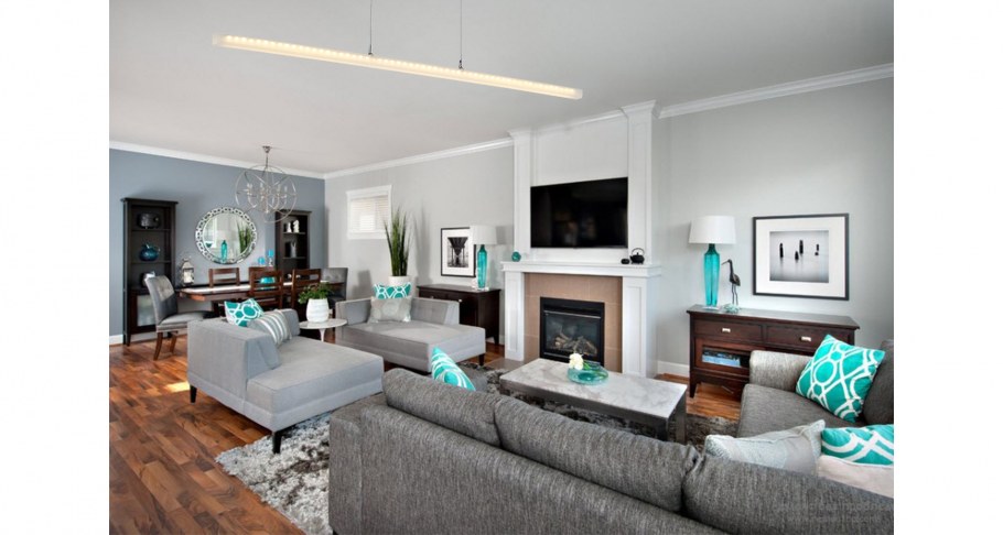 Гостиная с серым ламинатом и бирюзовые обои