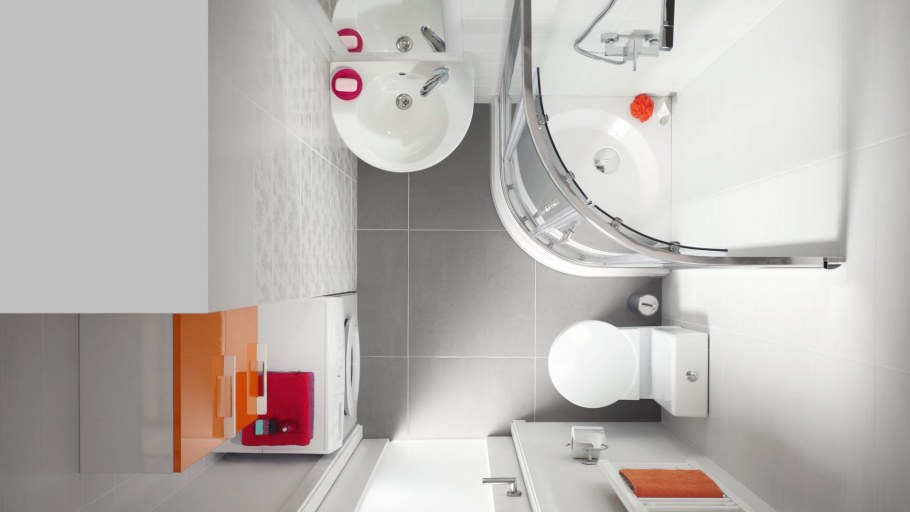 Маленький санузел с душевой кабиной унитазом и умывальником