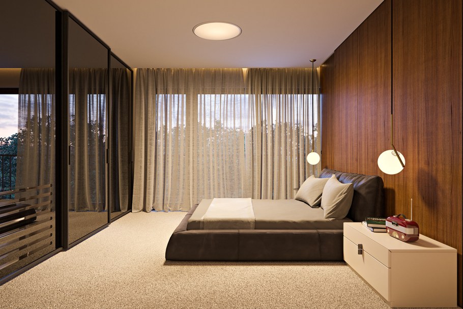 Кровать напротив окна в спальне