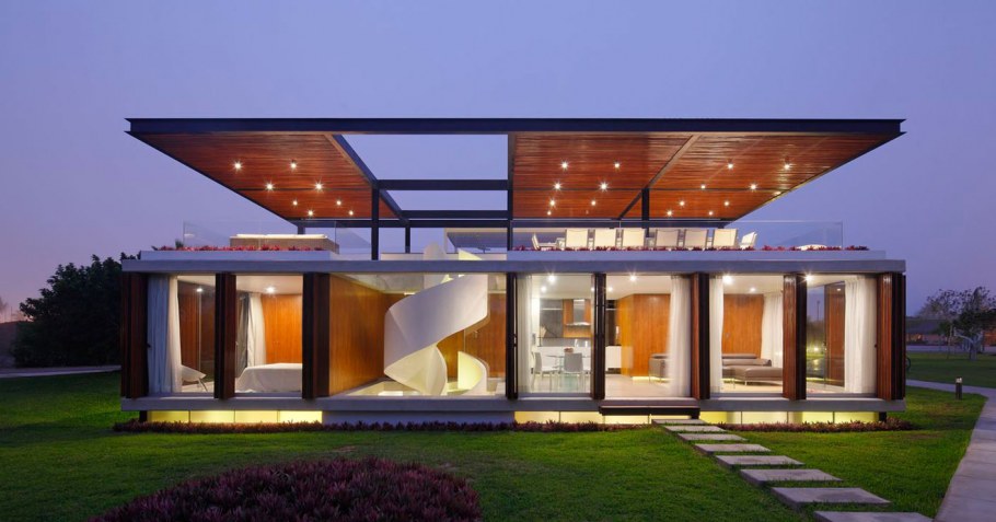 Двухэтажный дом с плоской крышей и панорамными окнами
